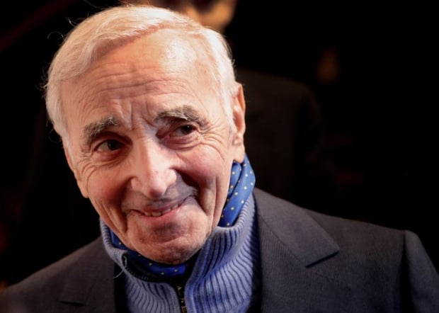 FILE PHOTO: French singer Charles Aznavour attends the annual dinner of CCAF (Co-ordination Council of Armenian organisations of France), in Paris, France, February 8, 2017. Picture taken February 8, 2017. REUTERS/Christophe Ena/Pool/File Photo