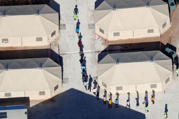 Immigrant children, many of whom have been separated from their parents under a new 