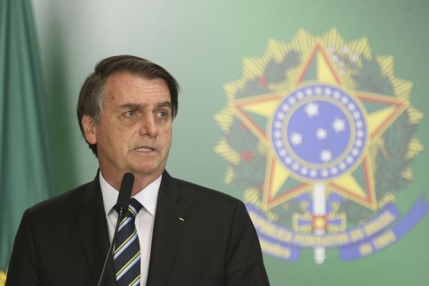 O presidente Jair Bolsonaro dá posse ao novo ministro da Educação, Abraham Weintraub, em cerimônia no Palácio do Planalto.