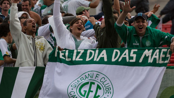 Supporters of Guarani holding a banner r