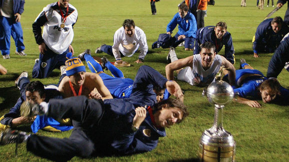 Guillermo Schelotto (C) of Argentina