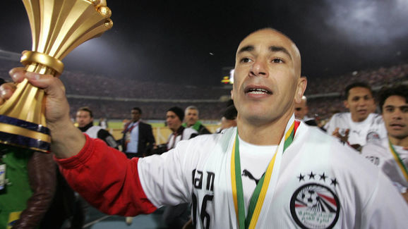 Egyptian forward Hossam Hassan (9), a le