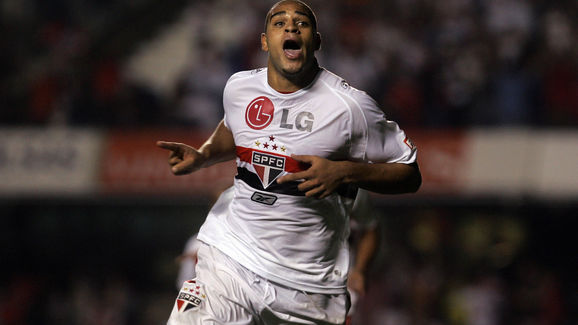 Adriano (C) of Sao Paulo FC celebrates h