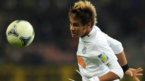 Santos FC forward Neymar heads the ball