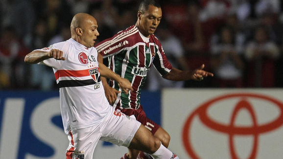 Brazilian Fluminense player Dodo (R) vie