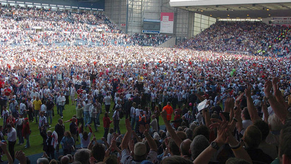 West Bromwich Albion fans celebrate on t