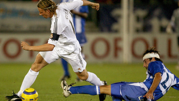 Real Madrid?s player Guti (L) vies with