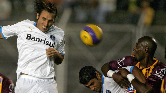 Rolando Schiavi (L) of Brazil