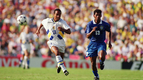 Martin Dahlin of Sweden and Aldair of Brazil