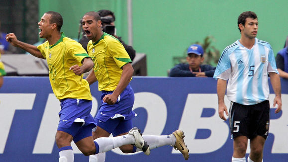 Brazilian Luis Fabiano (L) and Adriano c