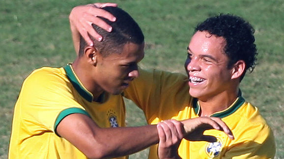 Brazilian Junior (L) and Lulinha celebra...