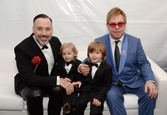  David Furnish, Elijah Furnish-John, Zachary Furnish-John, and Sir Elton John attend the 23rd Annual Elton John AIDS Foundation Academy Awards