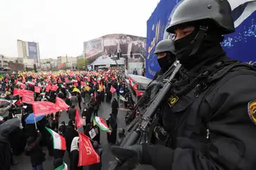 Reuters/Alaa Al-Marjani/Proibida reprodução Security personnel stand guard as Iranians take part in a protest marking the annual al-Quds Day (Jerusalem Day) on the last Friday of the holy month of Ramadan in Tehran, Iran, March 13, 2026. REUTERS/Alaa Al Marjani